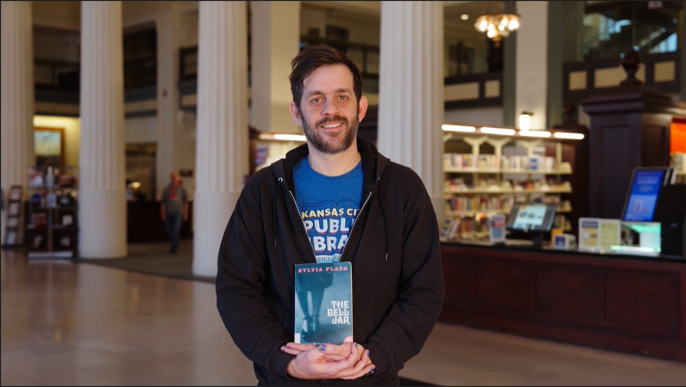 man holding book