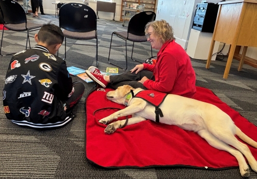 The Reading Education Assistance Dogs (R.E.A.D.) pairs a volunteer and a therapy animal, usually a dog, with a child.