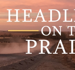 truck driving on gravel road at sunset