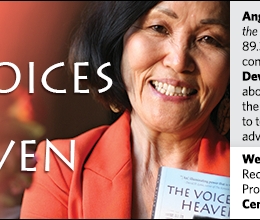 Woman smiles while holding book