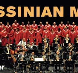 choir in red along with orchestra