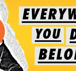 hooded man with orange circle blocking face