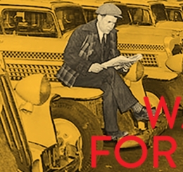 man sits on car reading paper