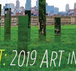 mirrored sculptures in grass