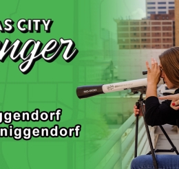 Two women on rooftop using telescope
