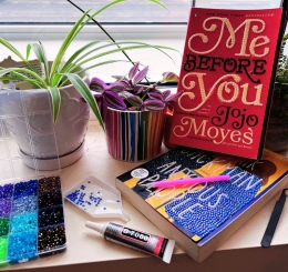 bedazzled books with rhinestones nearby