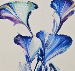 two canvases with blue paint