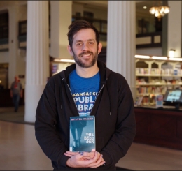 man holding book