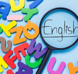 foam letters, magnifying glass, and the word "English"