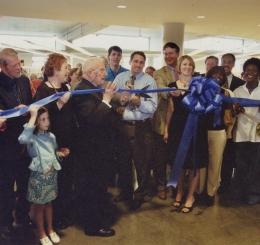 The Library's Joel Jones participates in a ribbon cutting at the Plaza Branch. 