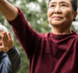 man and woman in tai chi pose