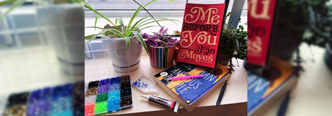 bedazzled books with rhinestones nearby