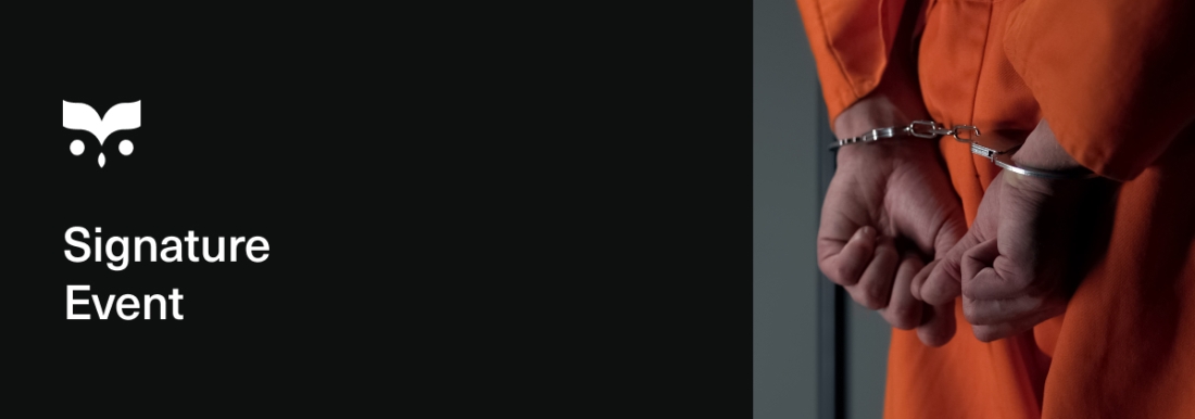 prisoner with hands cuffed behind back