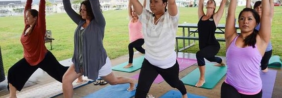 seven women in yoga poses