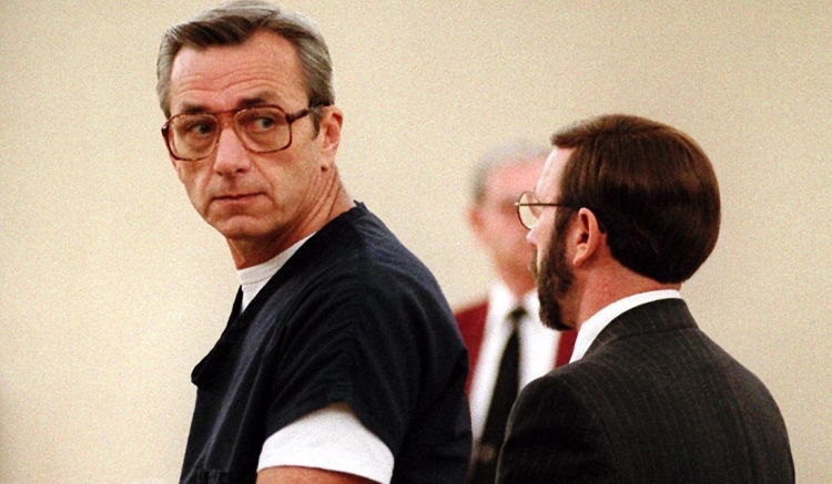 Two white men wearing dark clothing