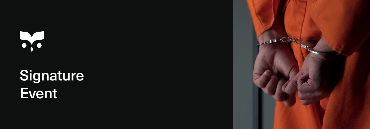 prisoner with hands cuffed behind back