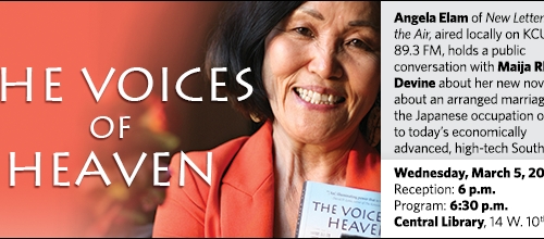 Woman smiles while holding book