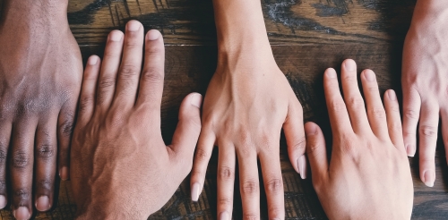 hands on a wooden suface