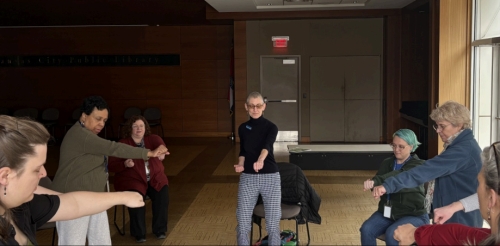 group of people doing moving meditation