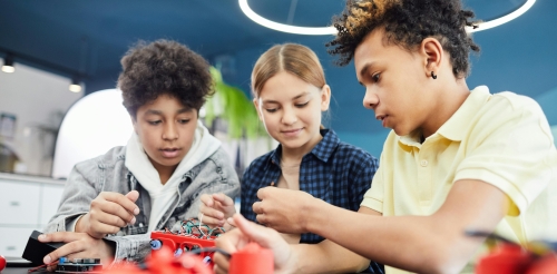3 children working with wires